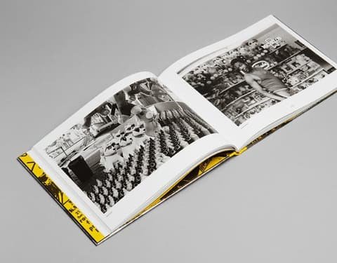 Open book Shot by Both Sides with black and white street photographs across both pages