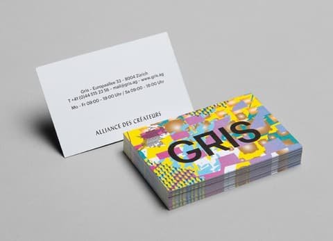 Stack of Gris business cards with the colourful pattern on the back