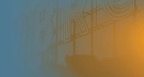 Blue-to-orange colour gradient with faint lettering from the Premotion image publication