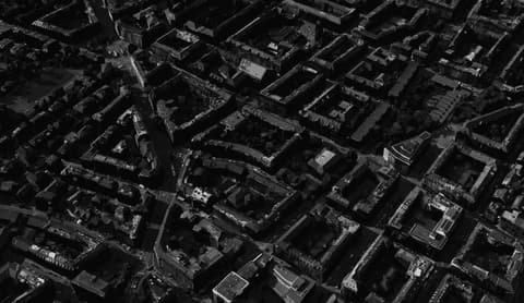Dark aerial view of a densely built city quarter in Zurich